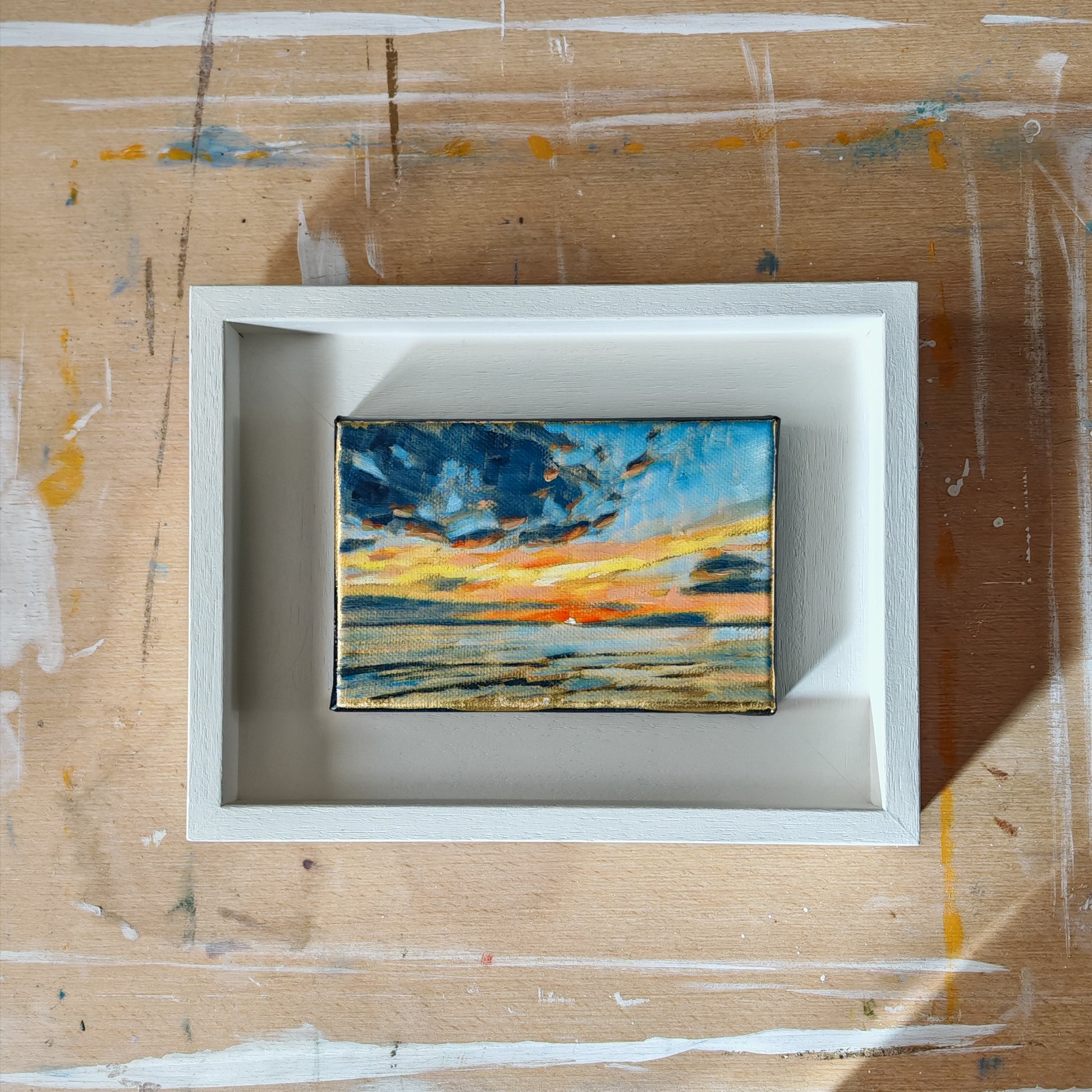 Oil painting of sunset, canvas on white frame