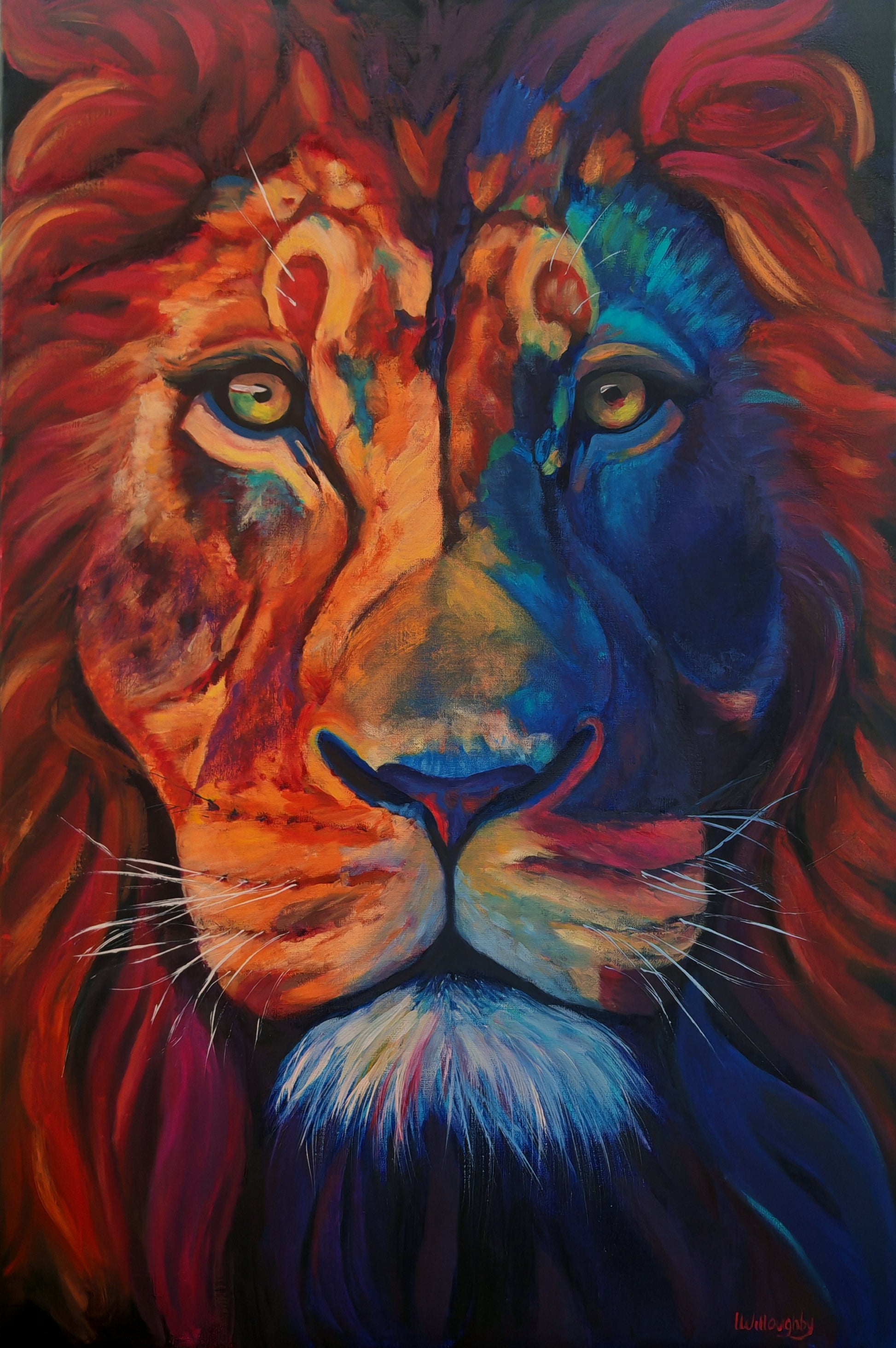 Colorful painting of a lion's face with vibrant red, blue, and orange hues.